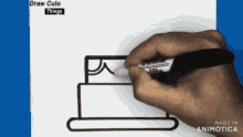 a person is drawing a cake on a piece of paper that says draw cute