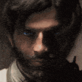 a close up of a person 's blue eye with a dark background