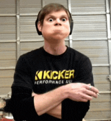 a man wearing a black shirt that says kicker performance ul