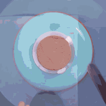 a chocolate cake is being decorated with chocolate sauce