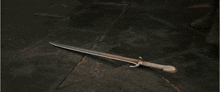 a group of people standing in front of a wall with swords hanging from it