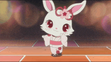 a white rabbit with pink ears and a flower on her head