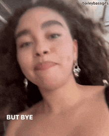 a close up of a woman 's face with the words `` but bye '' written on it .