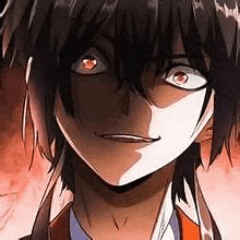 a close up of a person 's face with a shadow on it and red eyes .
