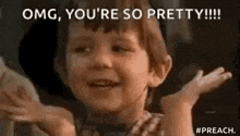 a little boy is smiling and saying `` omg , you 're so pretty '' .