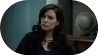 a woman with a serious look on her face is in an oval frame