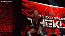 a woman is standing in front of a sign that says toxic spider heel