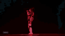a woman singing into a microphone with a watermark that says gascolla