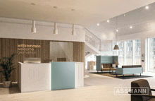 a reception area with the words willkommen welcome bienvenue on the wall