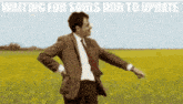 a man in a suit and tie is standing in a field with the words " waiting for souls hub to update "