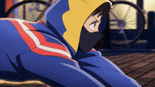 a person wearing a mask and a hoodie is looking at something
