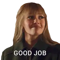 a woman in a black jacket is smiling and says good job