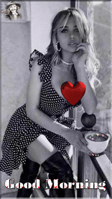 a woman in a polka dot dress has a red heart on her chest and the words good morning written on the bottom