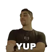 a man with his arms crossed is wearing a black shirt with the number 035 on it