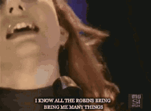 a close up of a woman 's face with the words " i know all the robins bring me many things "
