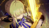 a girl is holding a sword in her hands .