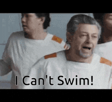 a man in a white shirt says i can t swim