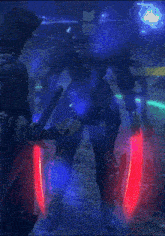 a blurry picture of a person holding a red light