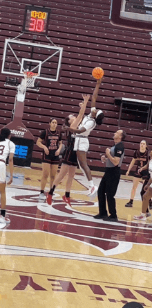 a basketball game is underway with a score of 30 to 0