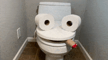 a toilet with two rolls of toilet paper on it 's seat