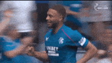 a man in a blue shirt with the word unibet on the front