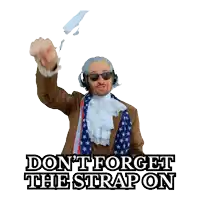 a man wearing headphones and an american flag scarf says " don t forget the strapon "