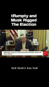 a video of donald trump sitting at a desk