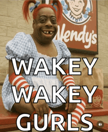 a wendy 's sign with a woman in a wendy 's costume
