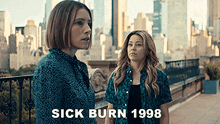 two women standing on a balcony with the words sick burn 1998