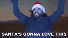 a man wearing a santa hat with the words santa 's gonna love this above him