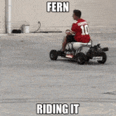 a man in a red shirt is riding a fern riding it