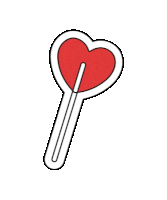 a red heart shaped lollipop on a stick .