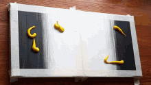 a black and white painting with yellow swirls of paint