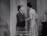 a black and white photo of a man and woman with the caption " you remember me "