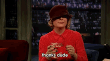 a woman sitting on a couch holding a glass with the words thanks dude above her
