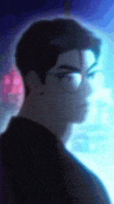 a blurry picture of a man wearing glasses with a blue background