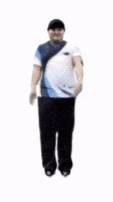 a man in a blue and white shirt is jumping in the air