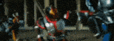 a group of people in armor are fighting each other in a room .