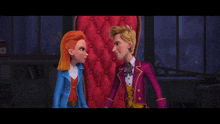 a man and a woman are standing next to each other