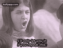 a black and white photo of a girl yelling at a man while eating cotton candy .
