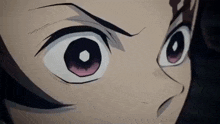 a close up of a person 's eyes in a cartoon with a serious look on their face .