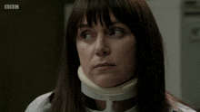 a woman with a collar around her neck is on a bbc show