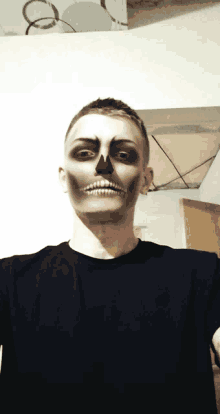 a man with a skeleton makeup on his face