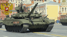 a green tank with a russian coat of arms on top of it