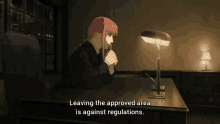 a woman sits at a desk with the words leaving the approved area is against regulations on the bottom