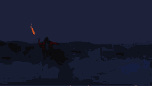 a woman in a red jacket is dancing in the dark with her hands in the air .