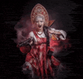 a woman in a red dress is holding a guitar and a sword