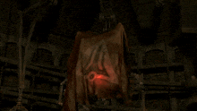a dark room with a red light shining on a piece of cloth that says ix on it