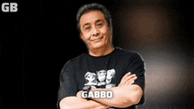 a man with his arms crossed is wearing a shirt that says gabbo