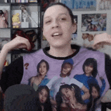 a man wearing a purple t-shirt with a picture of a group of women on it .